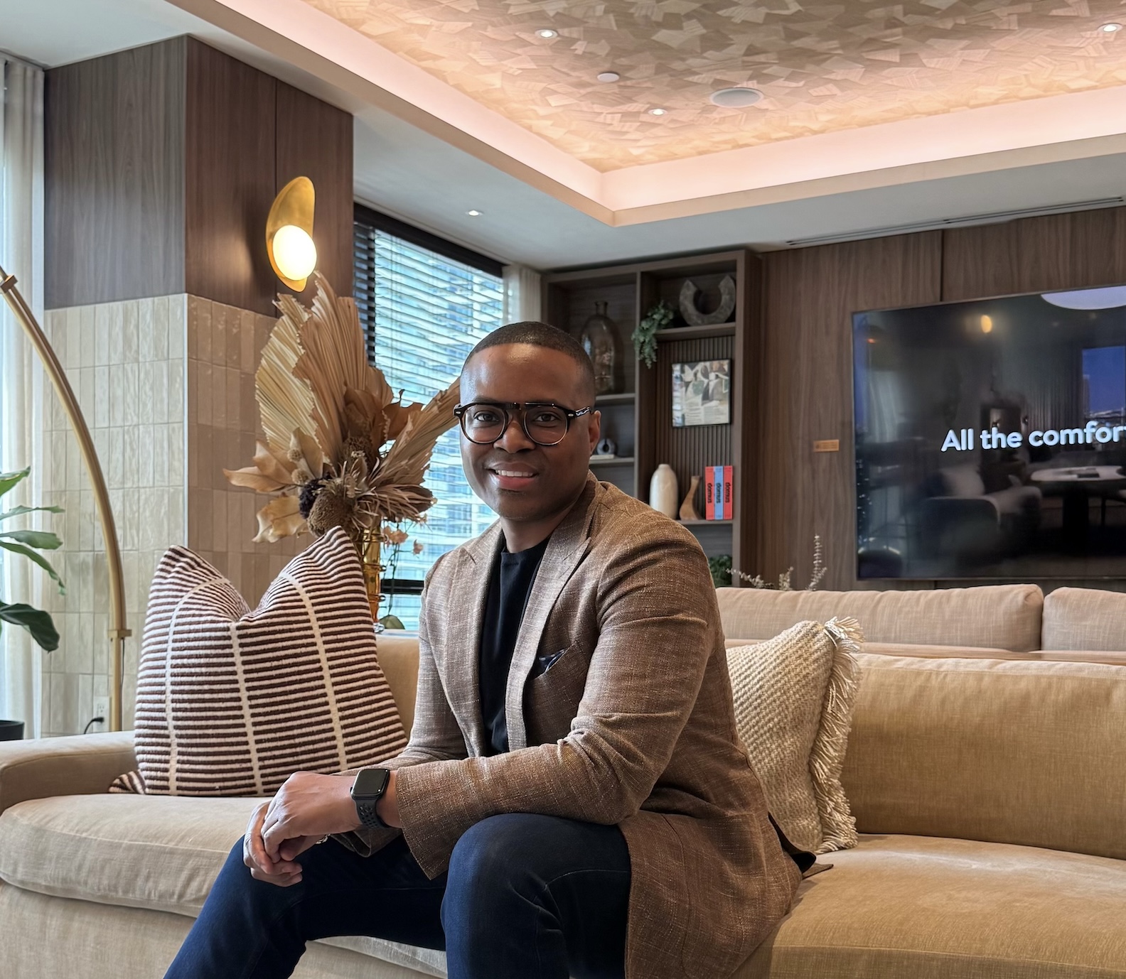 David McKnight seated in a warm, modern lounge